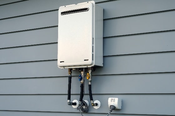 A photo of a tankless water heater installed outside