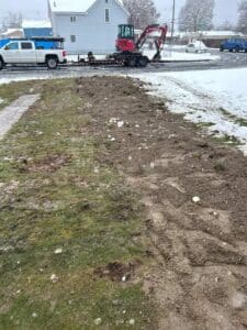 Drain repair project in Spokane WA with excavation equipment on site