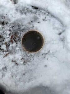 Exterior cleanout access in snow during mainline drain cleaning in Sprague WA