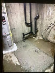 Sewer line repair in Spokane WA with new piping and concrete floor patch
