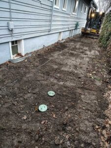 Completed excavation area after trenchless drain lining in Spokane
