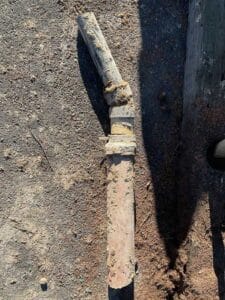 Damaged sewer pipe removed during drain repair excavation in Grand Coulee WA