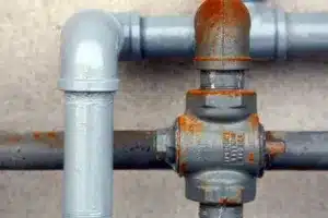 A photo of new piping installed next to old piping