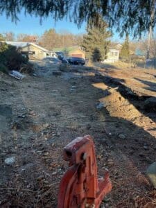 Drain repair excavation area before backfill at Grand Coulee home
