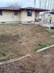 Backyard after sewer line repair in Spokane WA with minimal disruption Caption: Sewer line repair completed with minimal impact to the yard